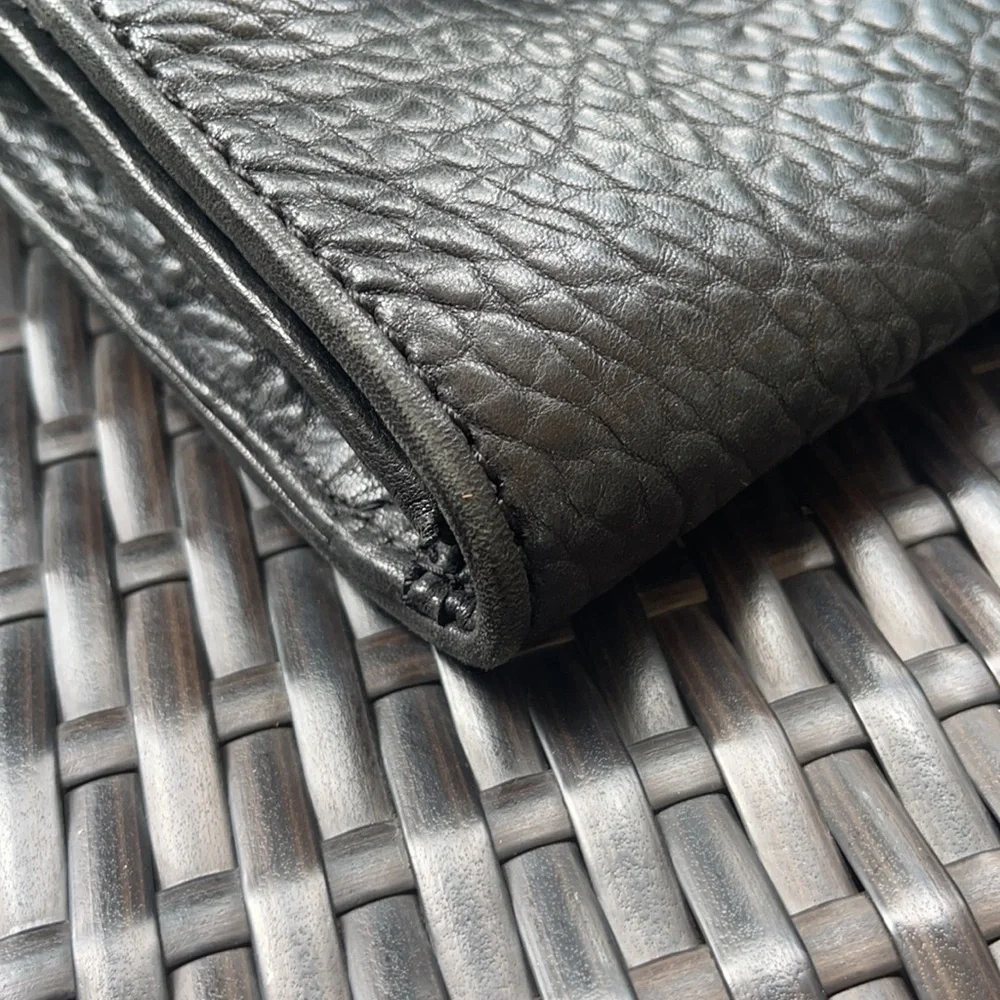 Michael kors Pebbled leather MK clutch with gun metal zipper.
